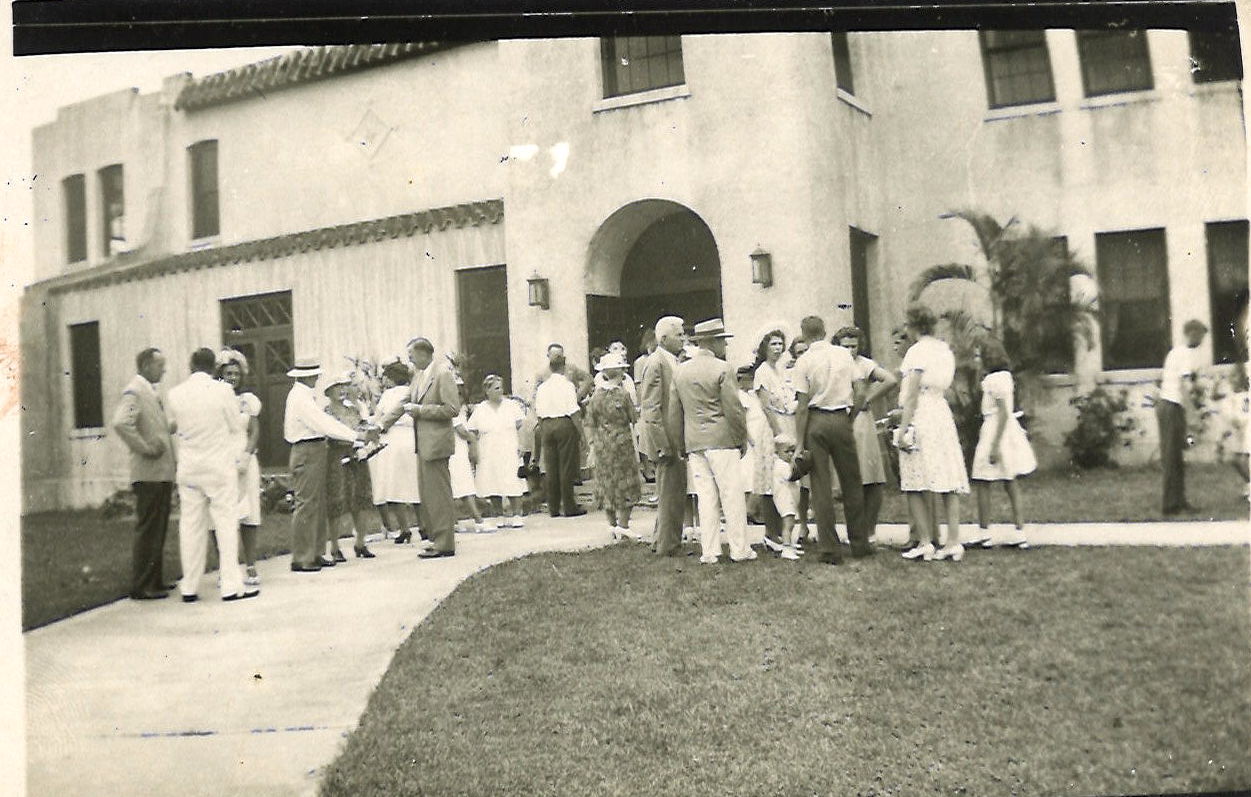 1930s church building and people on the lawn